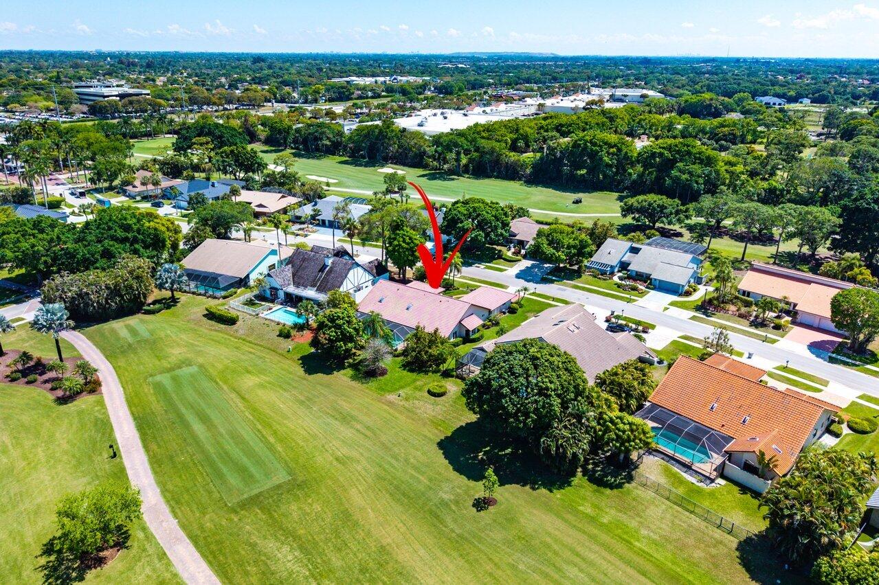 10215 Boca Woods Lane Boca Raton, FL 33428 - Photo 21 of 22 an aerial view of a houses with a swimming pool