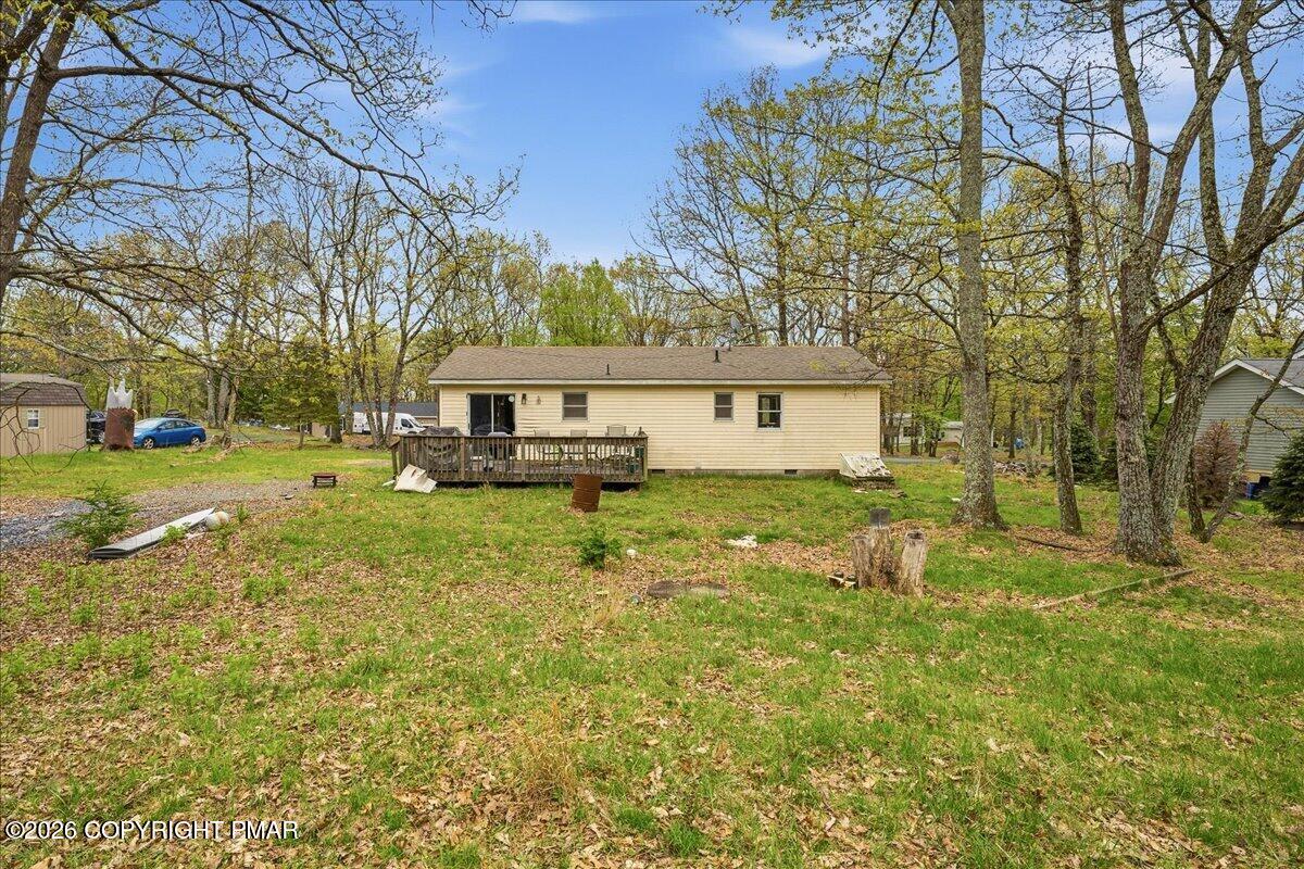 520 Hummingbird Court Bushkill, PA 18324 - Photo 15 of 17 a view of a house with backyard and tree