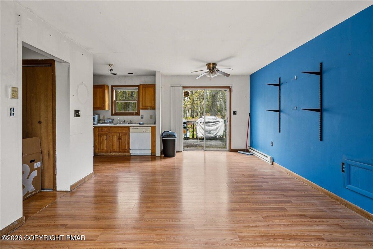 520 Hummingbird Court Bushkill, PA 18324 - Photo 5 of 17 a view of an empty room with window and wooden floor