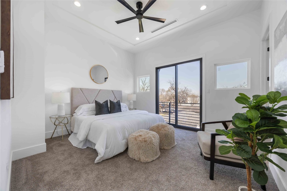 324 Janisch Road Houston, TX 77018 - Photo 8 of 18 a bedroom with a bed and a chandelier