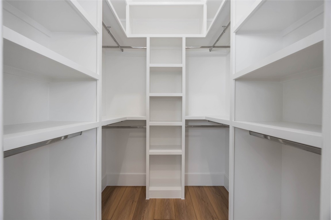 324 Janisch Road Houston, TX 77018 - Photo 10 of 18 a view of walk in closet with empty racks