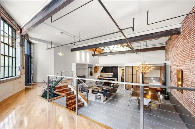 a dining room with furniture and a chandelier