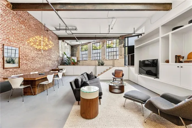 a kitchen with a sink cabinets and stainless steel appliances