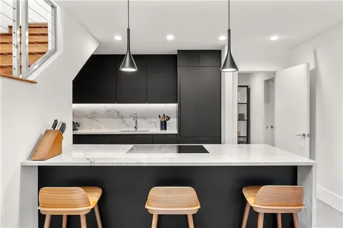 a kitchen with a table and chairs in it