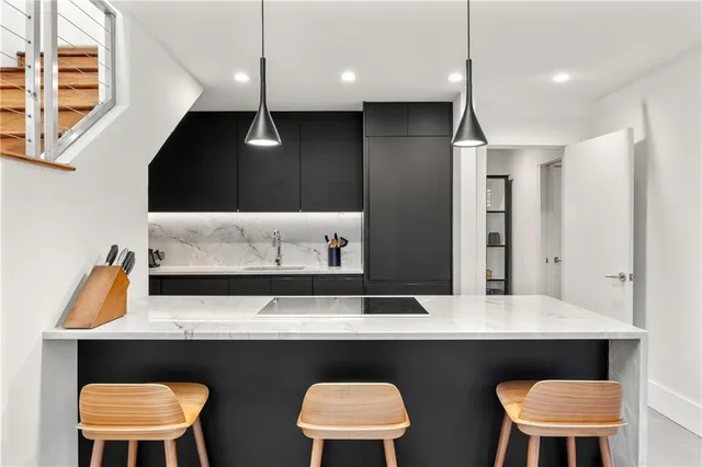 a kitchen with a table and chairs in it