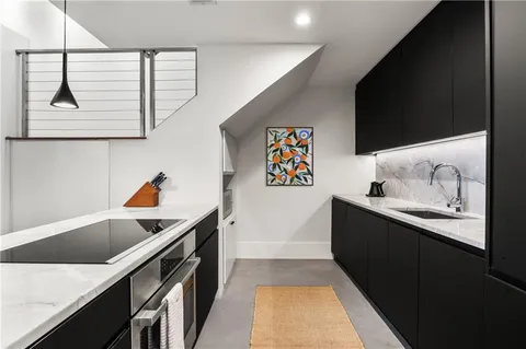 a bedroom with a bed and glass windows