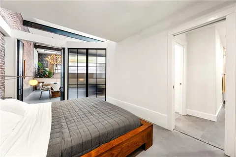 a bathroom with a granite countertop sink toilet a mirror a vanity and shower