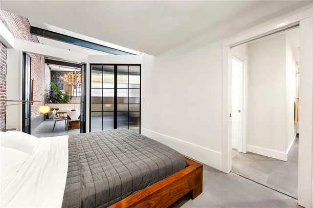 a bathroom with a granite countertop sink toilet a mirror a vanity and shower