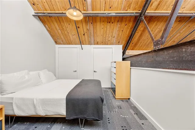 a bedroom with a bed and a view of bathroom