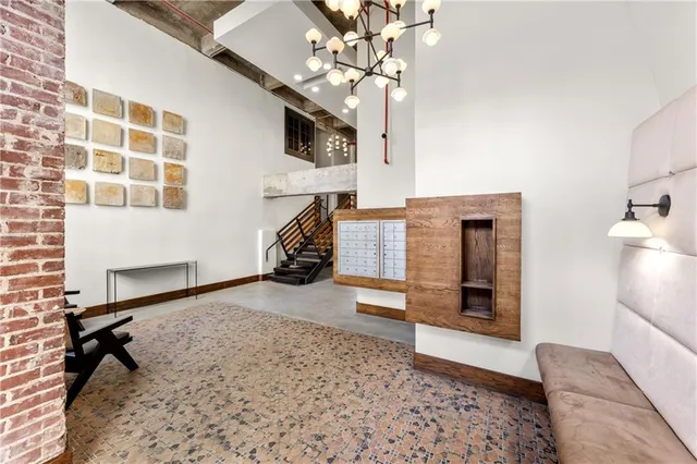 a view of a backyard with plants and a fountain