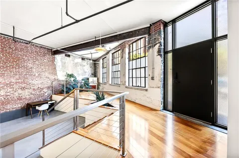a view of balcony with glass door and outdoor seating