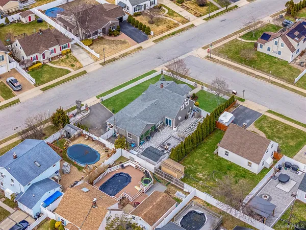 a aerial view of a house with a swimming pool