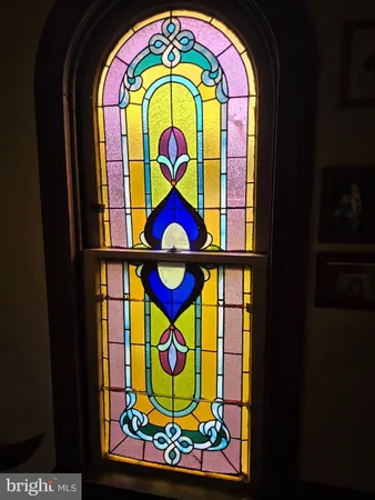 a kitchen with stainless steel appliances granite countertop a table chairs sink and cabinets