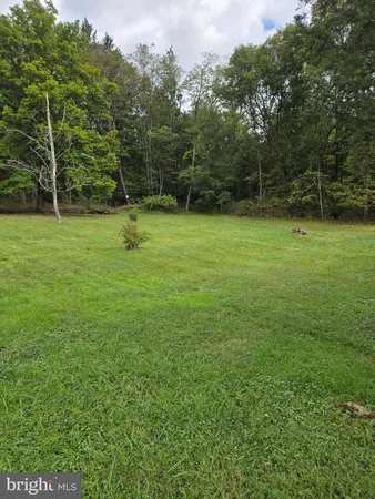 a view of a field with a small park