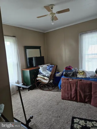 a bed room with a bed and a chandelier