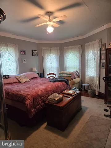 a living room with kitchen island furniture and a window