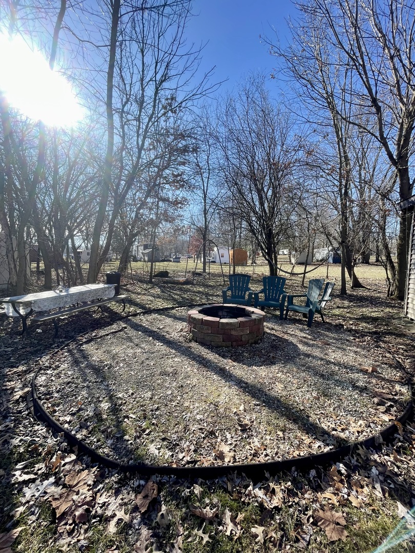 21-154 Woodhaven Lakes Sublette, IL 61367 - Photo 14 of 15 a view of a yard with snow on the road