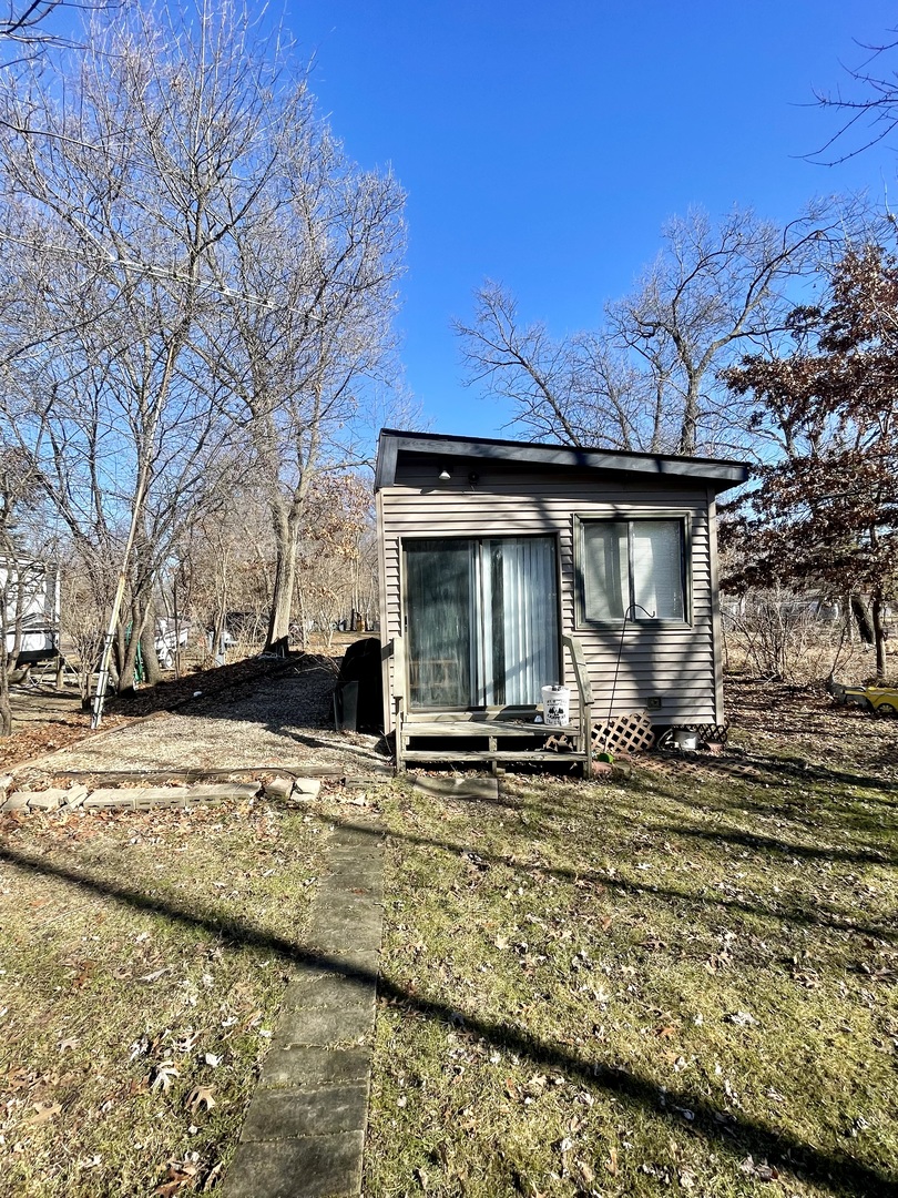 21-154 Woodhaven Lakes Sublette, IL 61367 - Photo 15 of 15 a front view of a house with garden