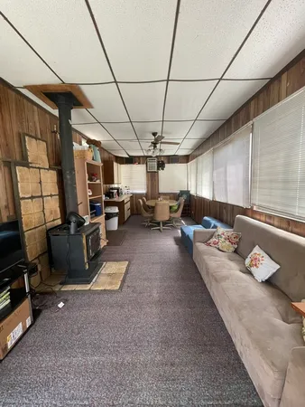a room with lots of windows and flat screen tv