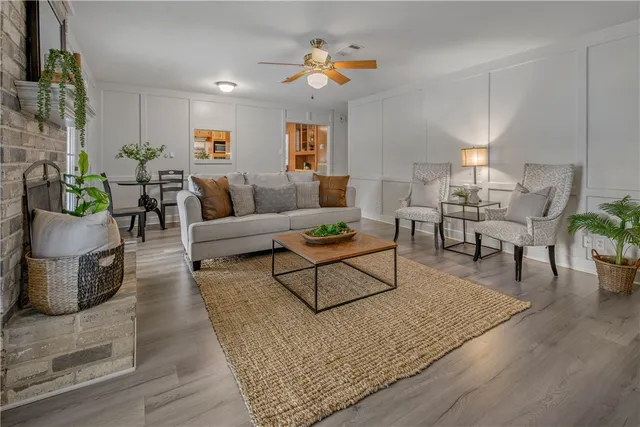 a kitchen with kitchen island granite countertop a sink appliances cabinets and a counter top space