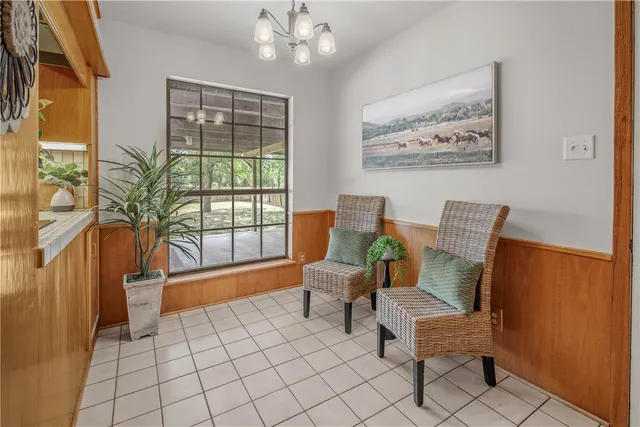 a view of a dining room with furniture and window