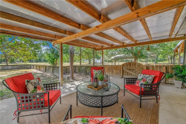 a patio with table and chairs