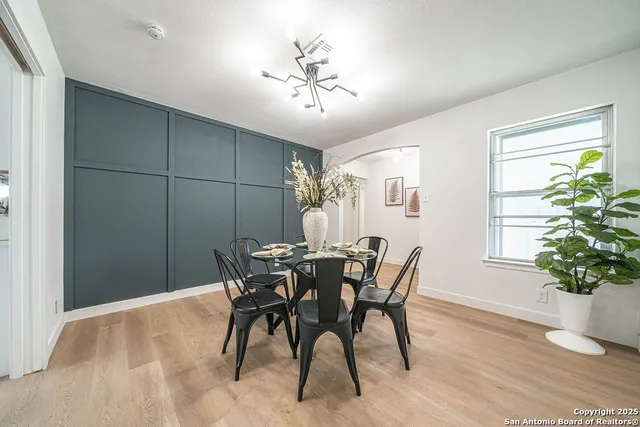 a dining room with furniture and window
