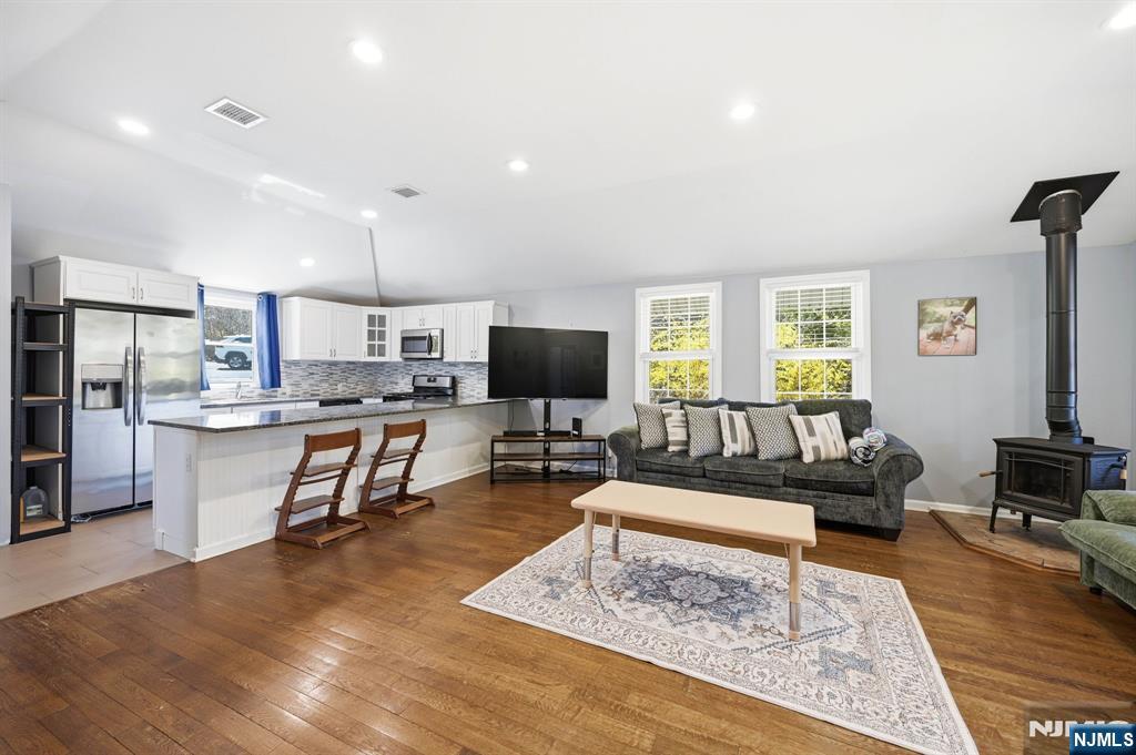 6 Timberwood Lane Oak Ridge, NJ 07438 - Photo 18 of 44 a living room with furniture and view of kitchen