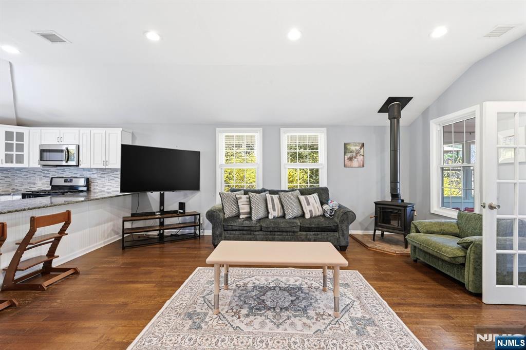 6 Timberwood Lane Oak Ridge, NJ 07438 - Photo 19 of 44 a living room with furniture and a flat screen tv