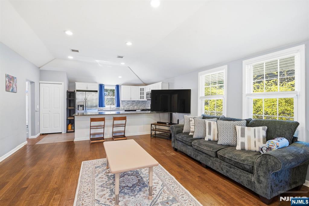 6 Timberwood Lane Oak Ridge, NJ 07438 - Photo 20 of 44 a living room with furniture and a flat screen tv