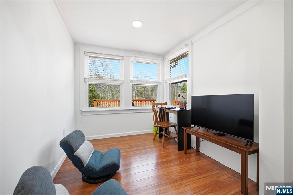 6 Timberwood Lane Oak Ridge, NJ 07438 - Photo 27 of 44 a living room with furniture and a flat screen tv
