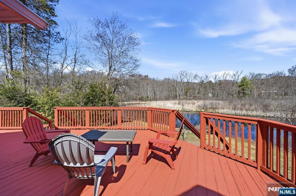 6 Timberwood Lane Oak Ridge, NJ 07438 - Photo 35 of 44 a view of a chairs and table on the roof deck