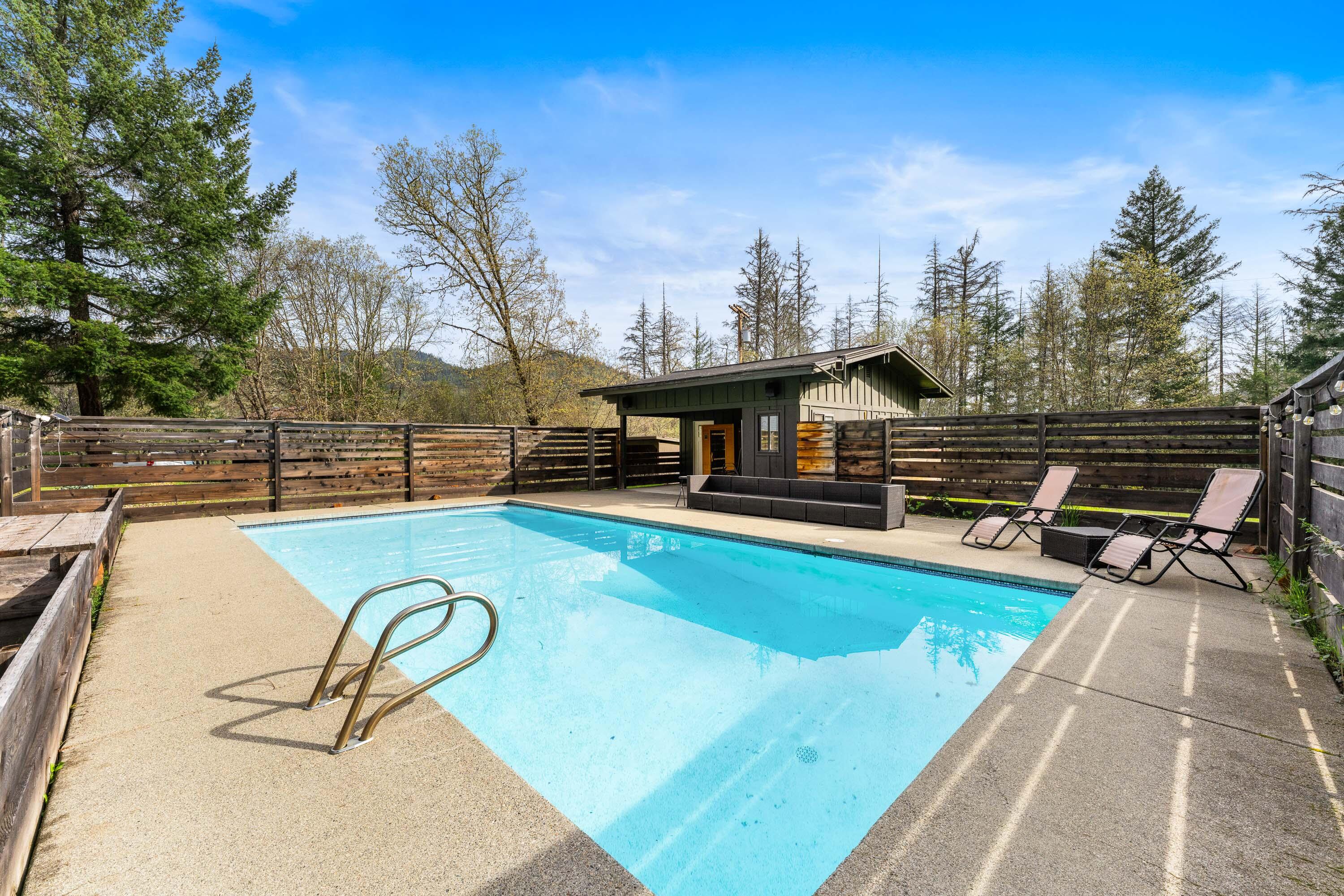 7201 Crowfoot Road Trail, OR 97541 - Photo 35 of 56 a view of a swimming pool with a lounge chair