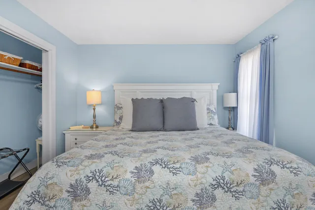 a large bed with a bed and a night stand