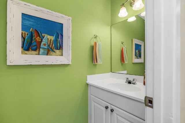 a bathroom with a sink and mirror