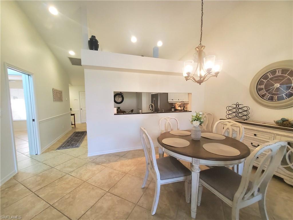 992 Marblehead Drive Naples, FL 34104 - Photo 18 of 50 a dining room with furniture and chandelier