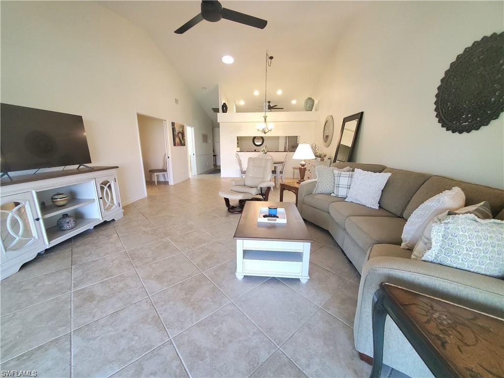992 Marblehead Drive Naples, FL 34104 - Photo 22 of 50 a living room with furniture and a flat screen tv