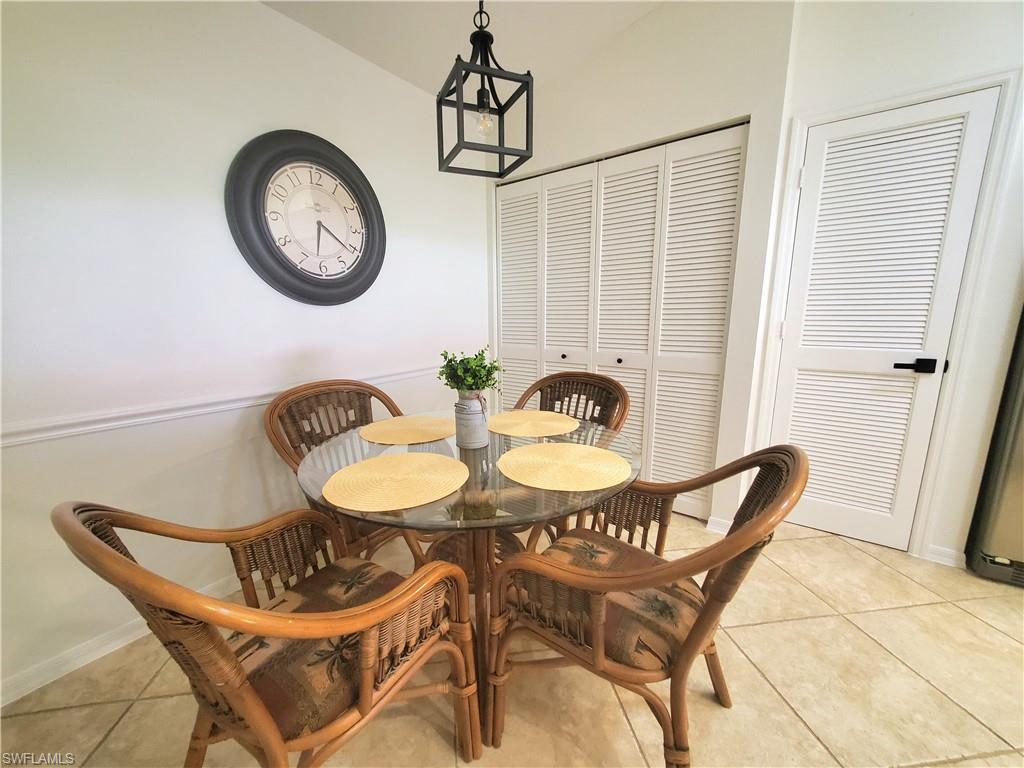 992 Marblehead Drive Naples, FL 34104 - Photo 23 of 50 a view of a dining room with furniture and a window