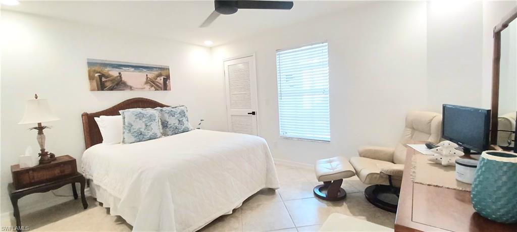 992 Marblehead Drive Naples, FL 34104 - Photo 33 of 50 a bedroom with a bed and furniture