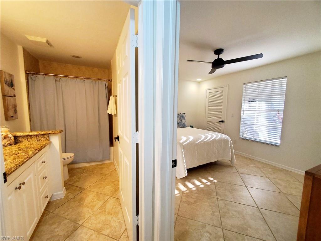 992 Marblehead Drive Naples, FL 34104 - Photo 35 of 50 a bathroom with a tub sink and mirror