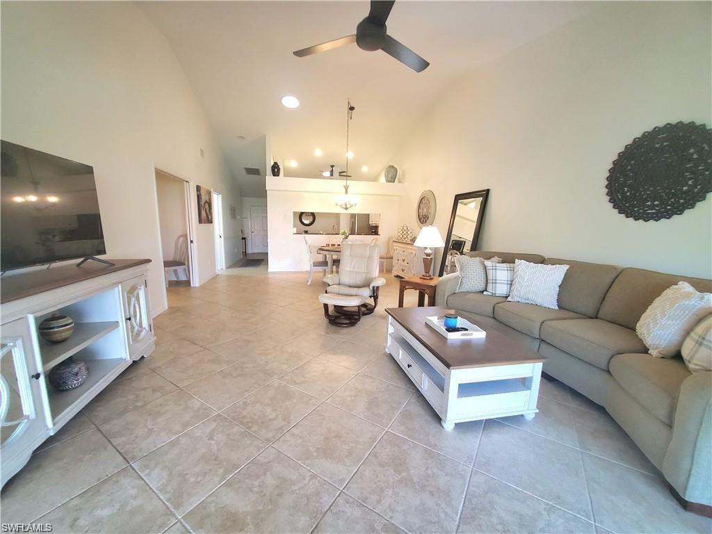 992 Marblehead Drive Naples, FL 34104 - Photo 36 of 50 a living room with furniture and a flat screen tv