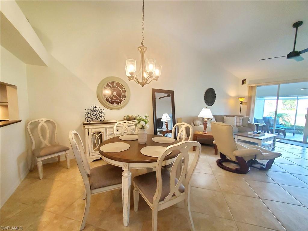 992 Marblehead Drive Naples, FL 34104 - Photo 50 of 50 a dining room filled chandelier and kitchen view