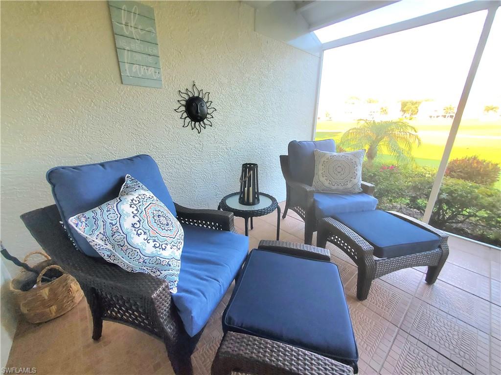 992 Marblehead Drive Naples, FL 34104 - Photo 37 of 50 a living room with furniture and wooden floor
