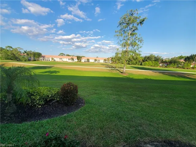 a view of a chairs and table in the balcony