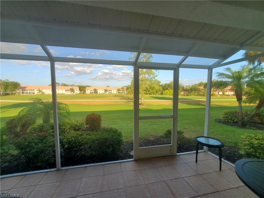 992 Marblehead Drive Naples, FL 34104 - Photo 40 of 50 a view of a porch with furniture and garden