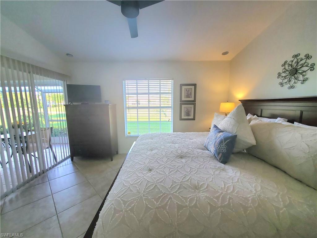 992 Marblehead Drive Naples, FL 34104 - Photo 7 of 50 a spacious bedroom with a bed and a window