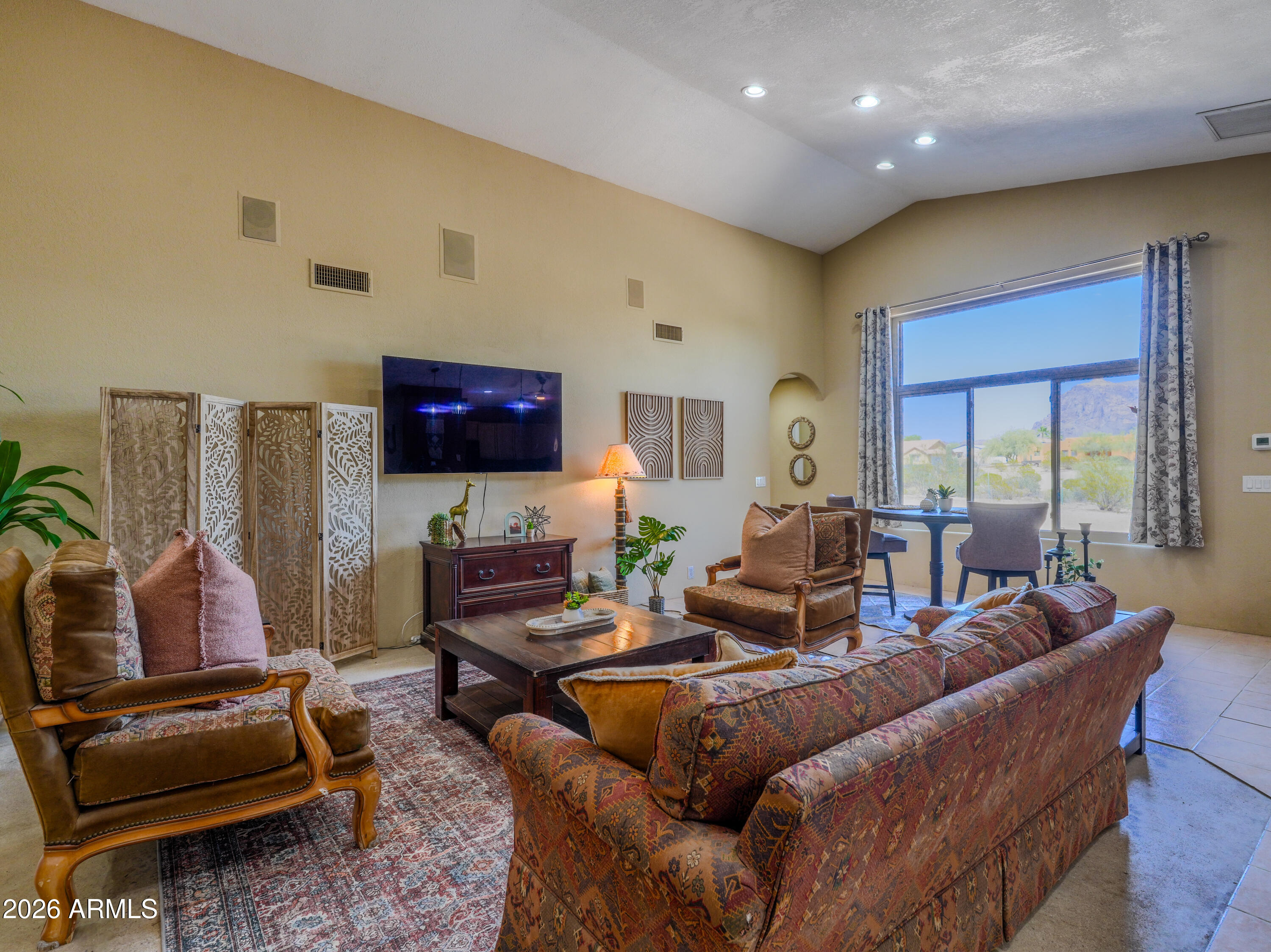 1224 North Acacia Road Apache Junction, AZ 85119 - Photo 13 of 48 a living room with furniture and a flat screen tv