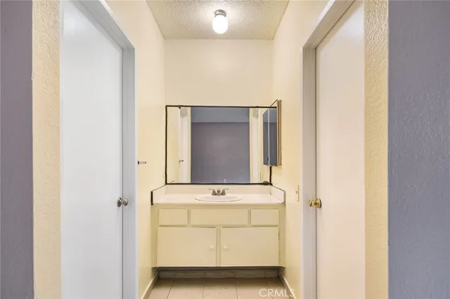 a view of vanity with mirror