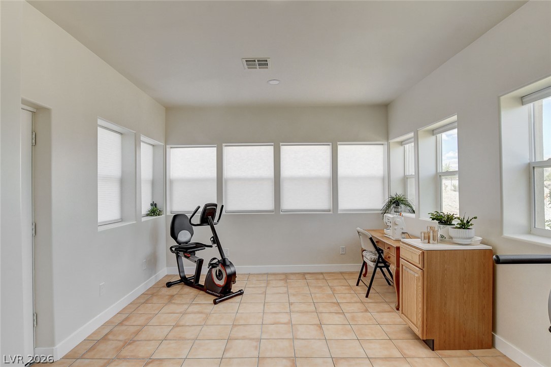 1950 Bowman Road Logandale, NV 89021 - Photo 33 of 81 A versatile bonus Arizona room offers ample space, bathed in natural light, perfect for a home gym or creative studio.