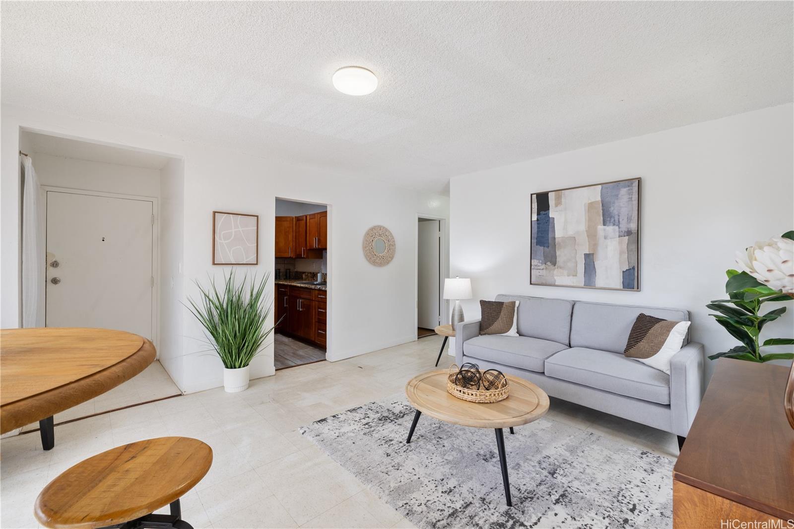 87-119 Helelua Street, Unit F204 Waianae, HI 96792 - Photo 4 of 24 a living room with furniture and wooden floor